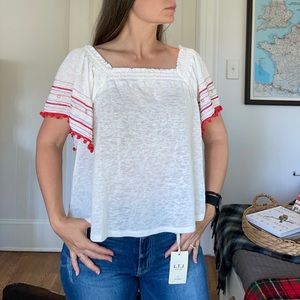 Cute summer top with shoulder ruching, embroidery, & pompoms. SZ M EUC